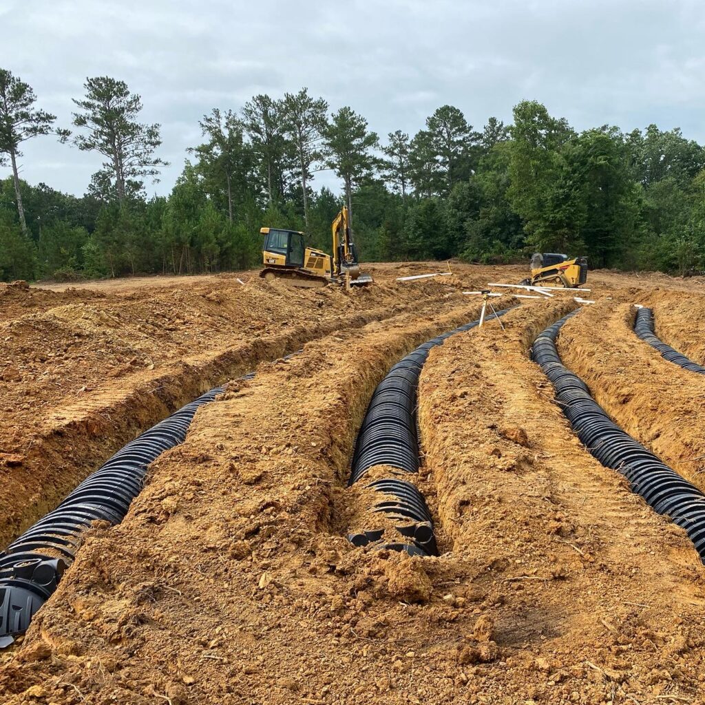 Pipes laid in a trench after excavation for development in Adairsville GA.
